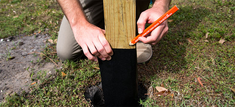 Marking deck post before applying DeckWise® WiseWrap LedgerTape<sup>®</sup>